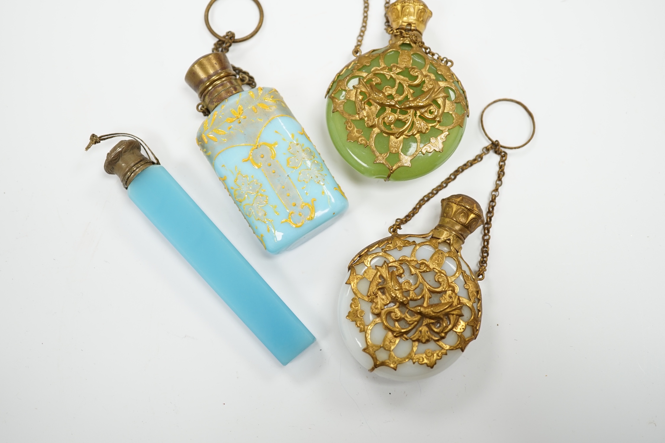 A group of four glass scent bottles with gilt metal mounts, largest 9cm high